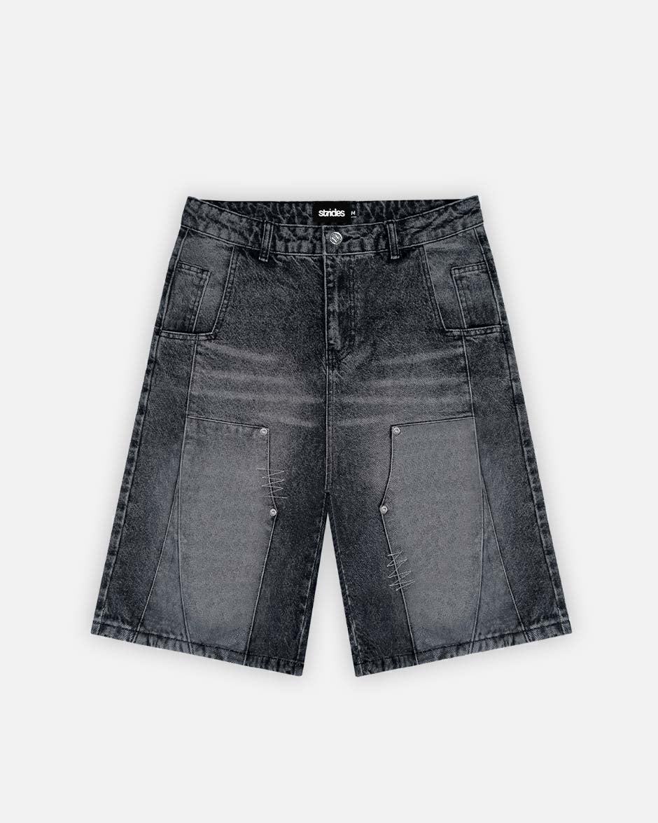 A pair of black carpenter split jorts with a wide fit and logo leather patch on the front pocket.