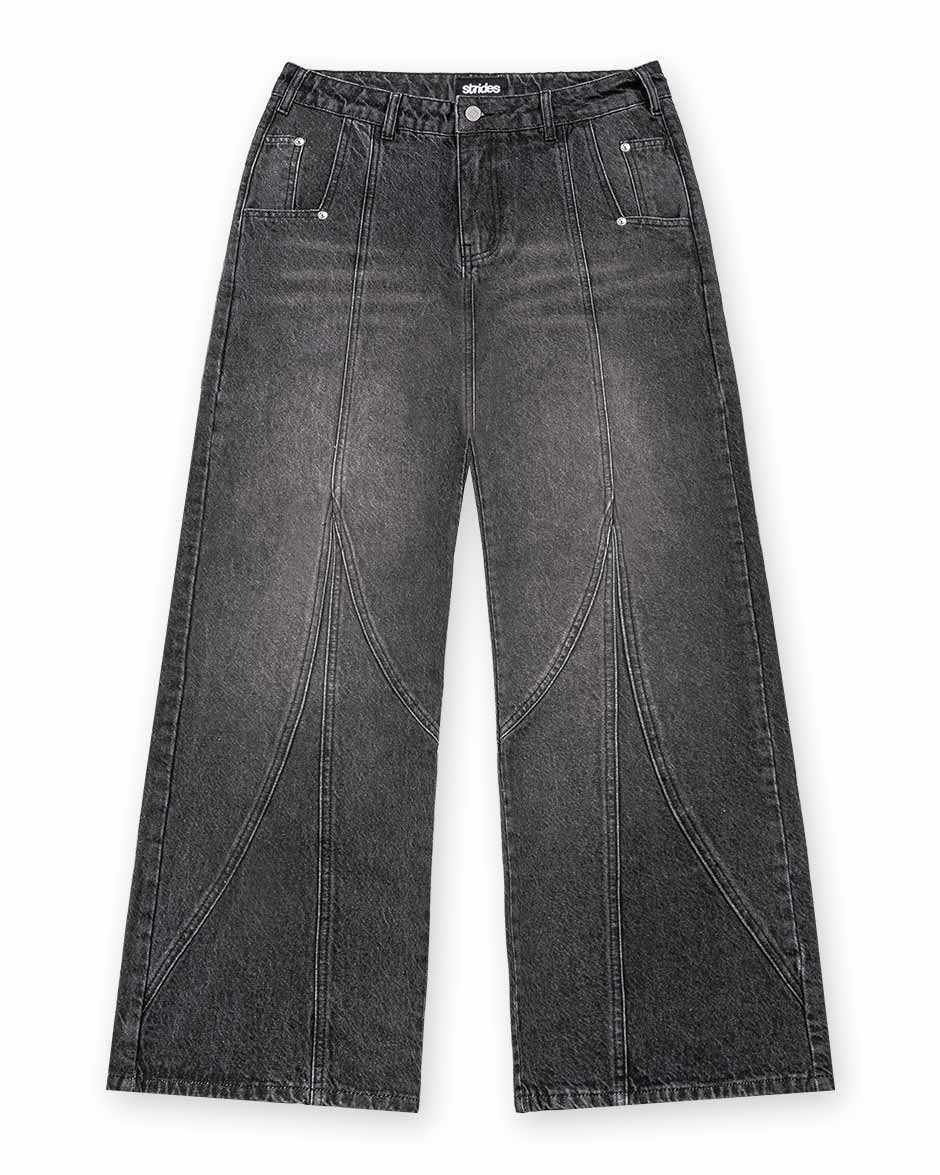 A pair of black denim jeans with a wide fit and visible stitching details, featuring a button and a leather patch on the back pocket.