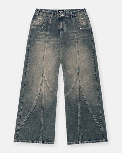 Tmavě modré denim džíny s yellow wash a střihem baggy fit, s viditelným prošíváním a zapínáním na knoflíky vpředu.
