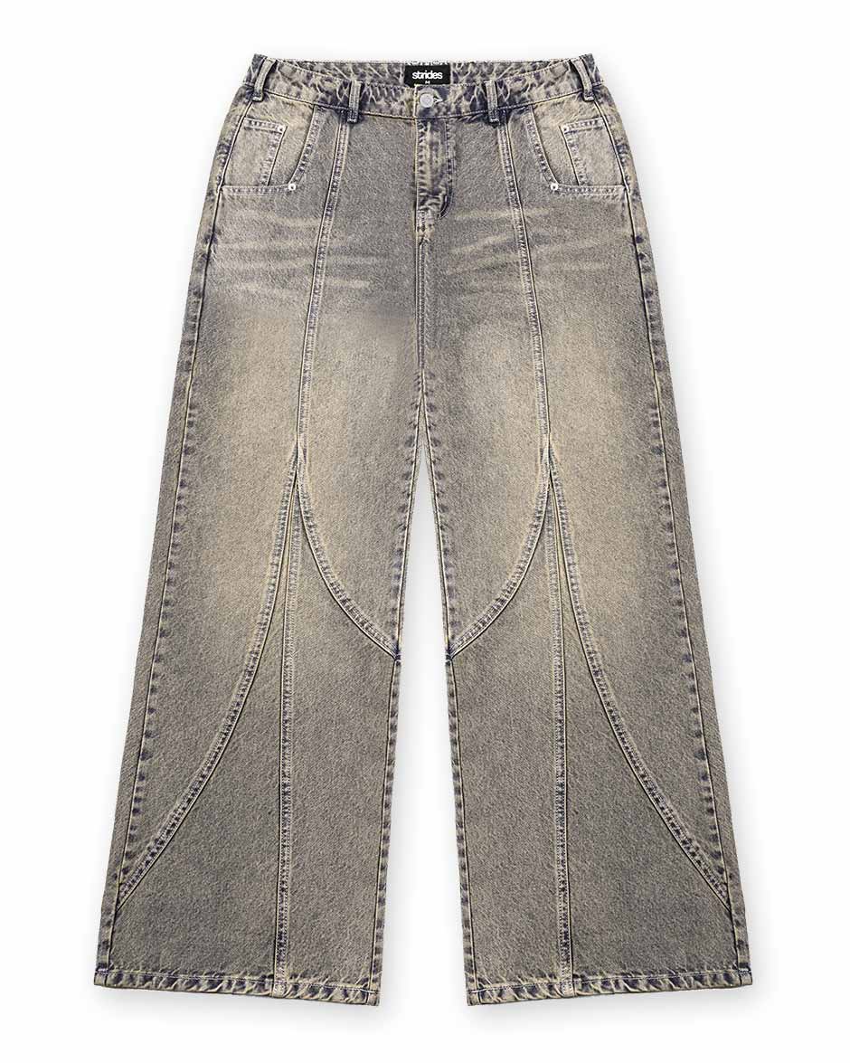 A pair of light grey denim jeans with a wide fit and distinctive yellow wash details, including sewing lines and a logo leather patch at the back.