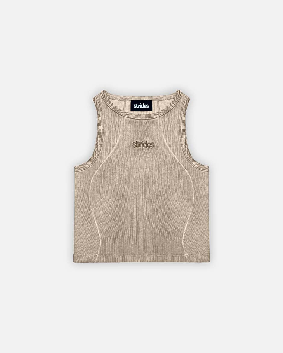 A beige, sleeveless, fine ribbed crop top with oil wash finish and logo embroidery on the front.