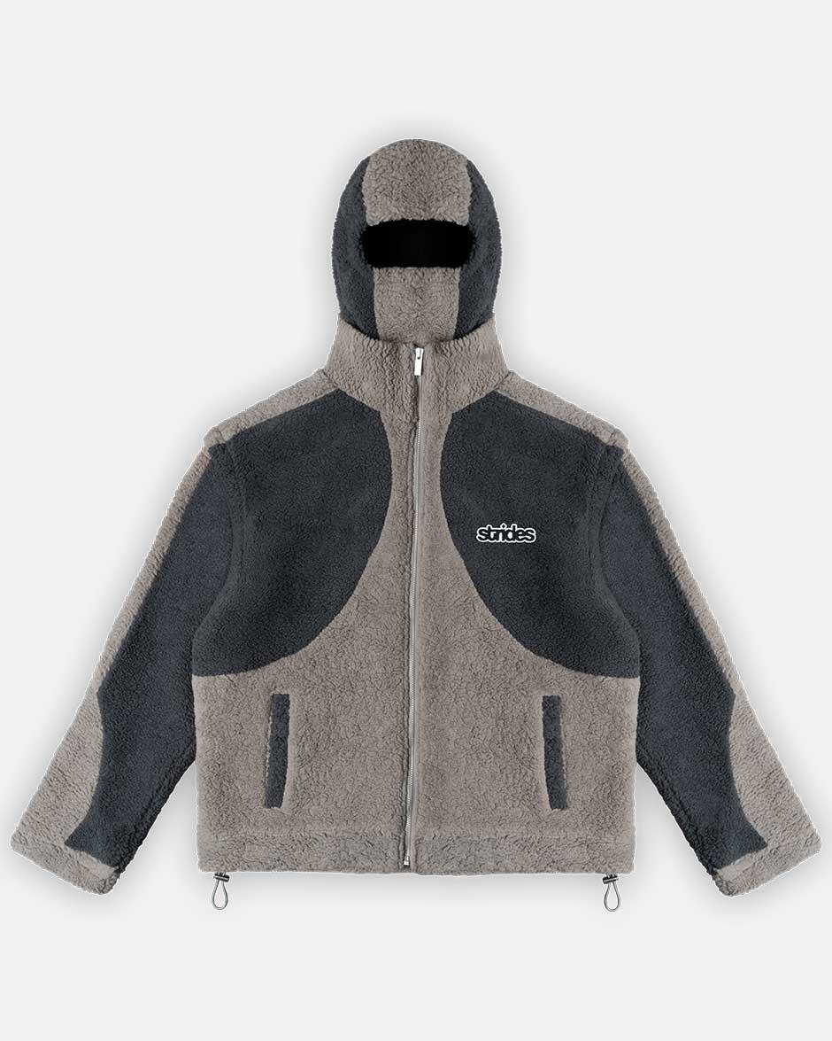 A grey fleece jacket with detachable balaclava hood and logo embroidery, featuring a two-tone fleece pattern, drawstrings, and crop-length sleeves.