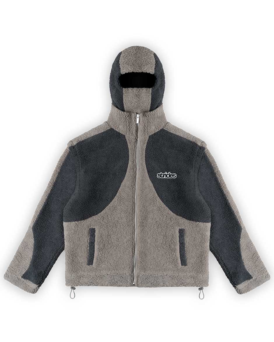 A grey fleece jacket with detachable balaclava hood and logo embroidery, featuring a two-tone fleece pattern, drawstrings, and crop-length sleeves.