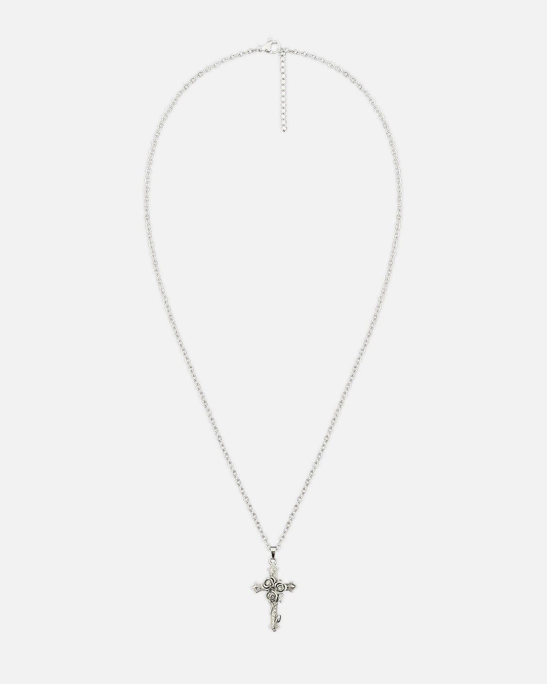 Silver cross necklace on a white background
