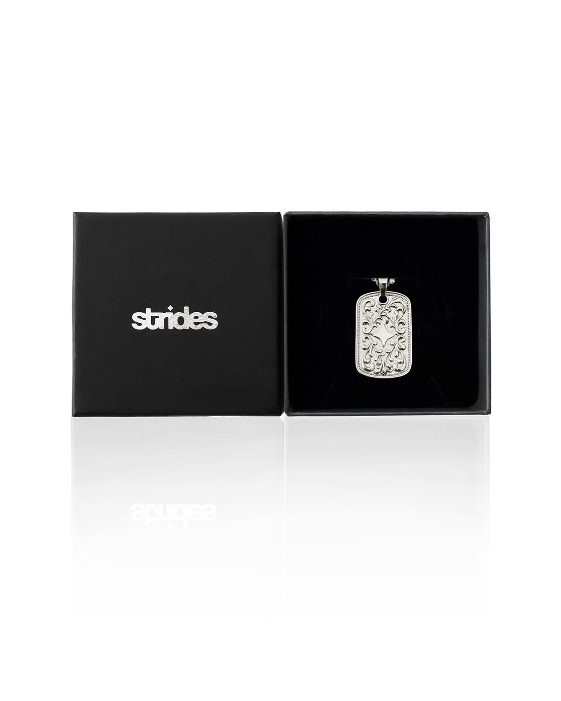Silver pendant in a black box with 'strides' branding on a white background