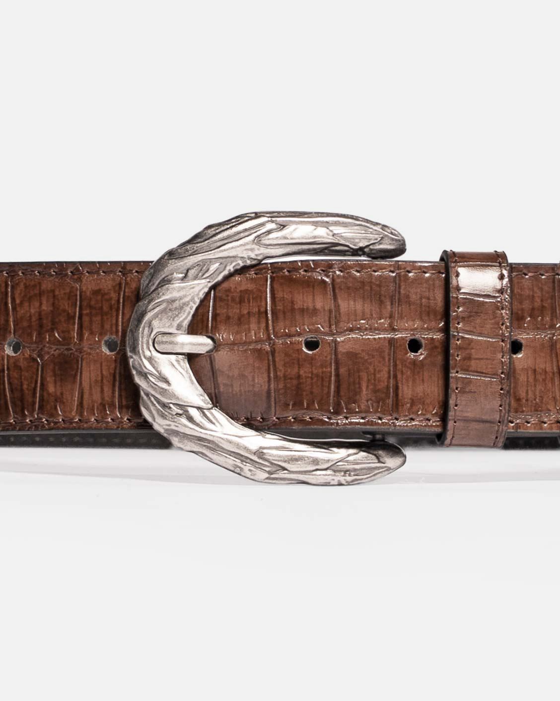 Close up shot of a brown leather belt with silver buckle on a white background