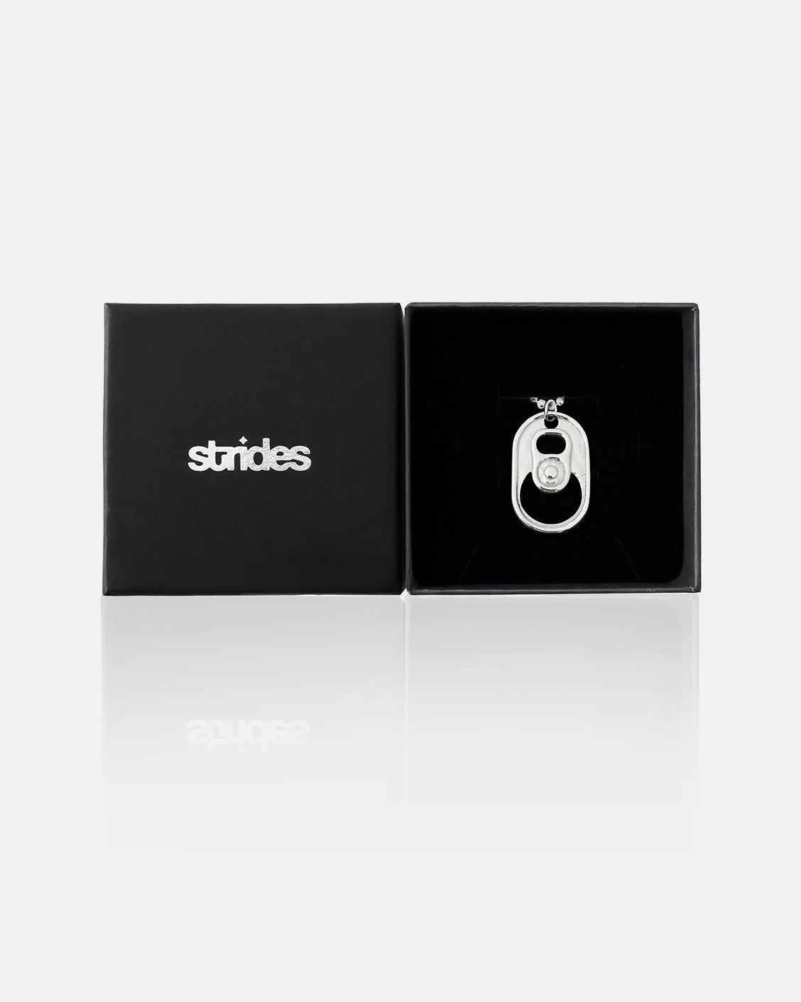 Black box with 'strides' branding and a silver ring holder on a white background