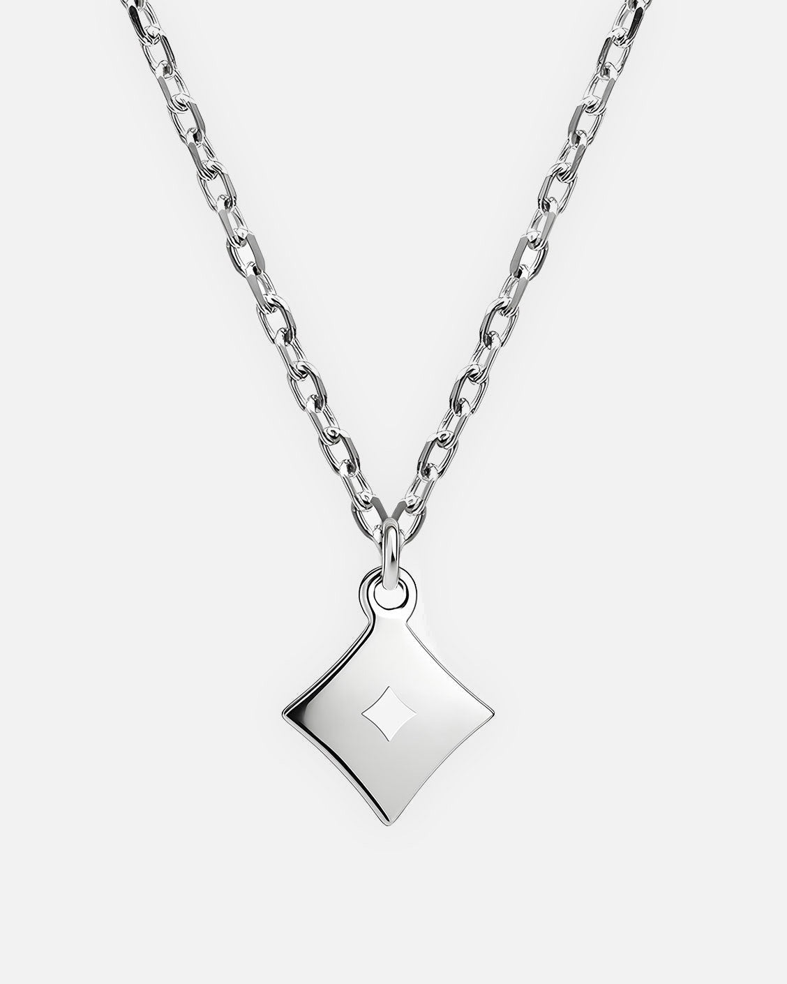 Silver necklace with a geometric pendant on a white background