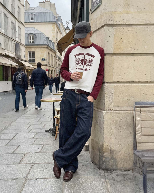 In Paris, wearing the burgundy Heritage Raglan Longsleeve with baggy raw denim
