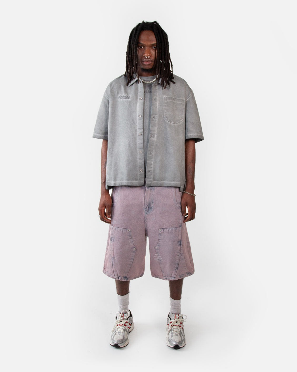 Carpenter Split Jorts Acid Pink, worn by a model on a light grey background