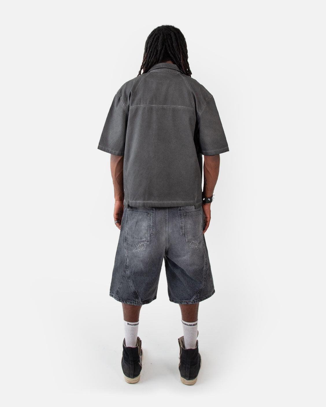 Carpenter Split Jorts Black, worn by a model on a light grey background