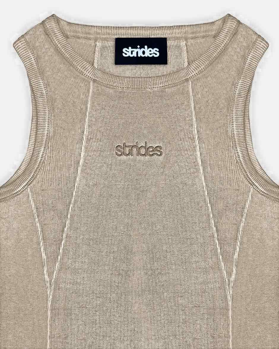 Line Tank Top Beige Oil Wash, close-up detail on a light grey background