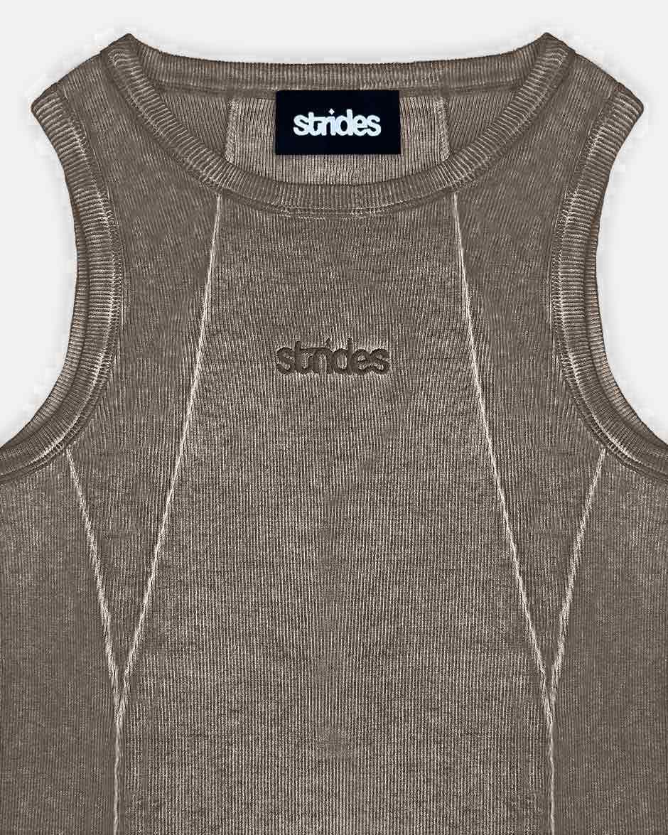 Line Tank Top Brown Oil Wash, close-up detail on a light grey background