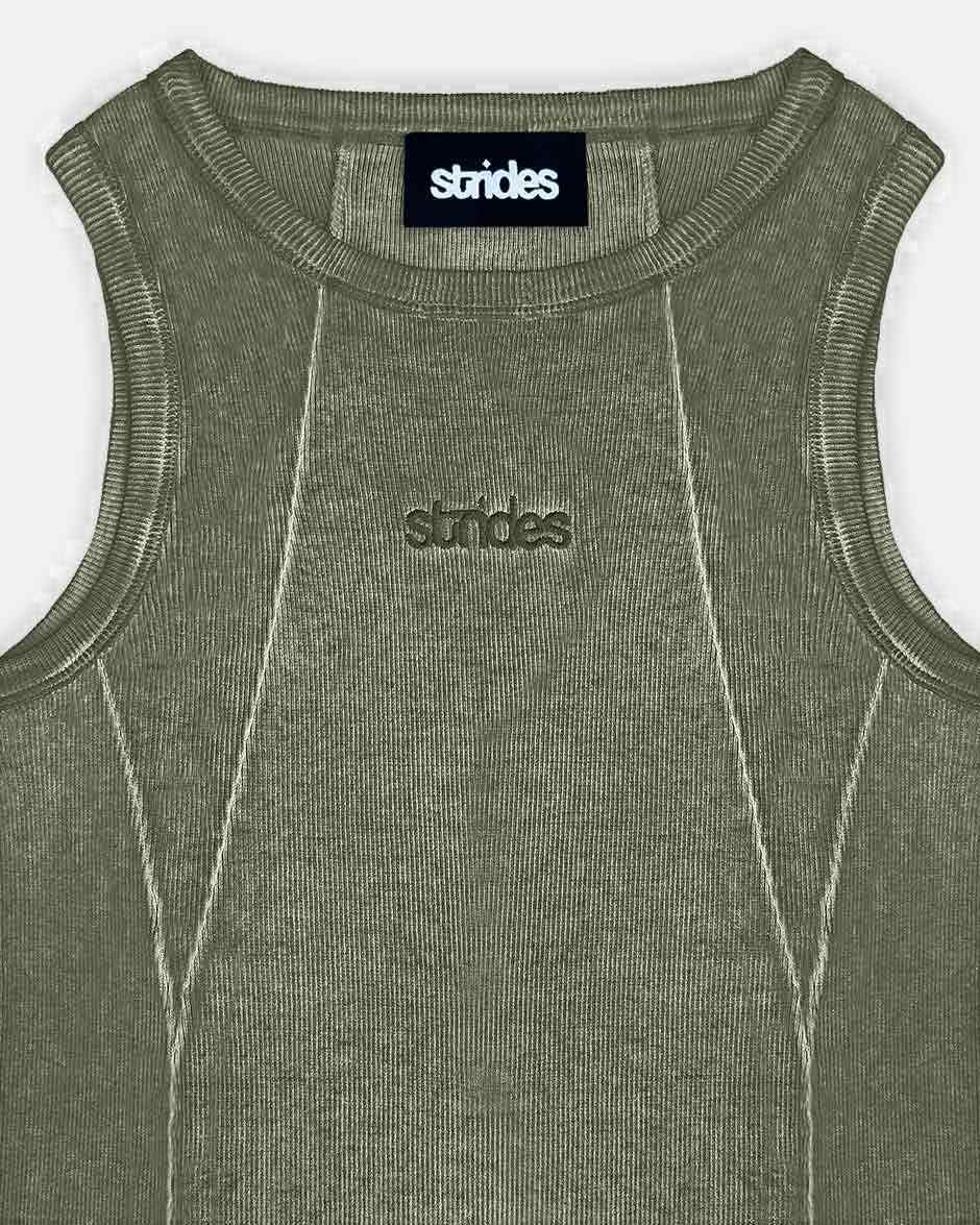 Line Tank Top Olive Oil Wash, close-up detail on a light grey background