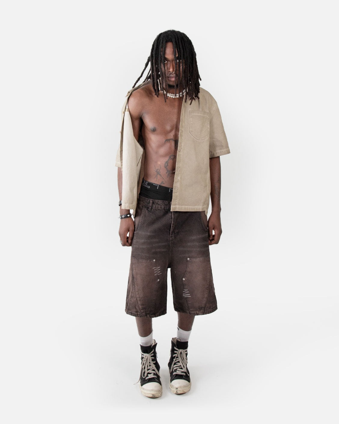 Carpenter Split Jorts Brown, worn by a model on a light grey background