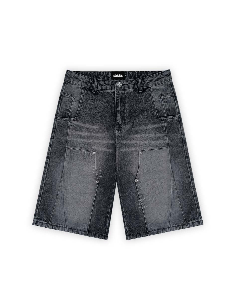 A pair of black carpenter split jorts with a wide fit and logo leather patch on the front pocket.