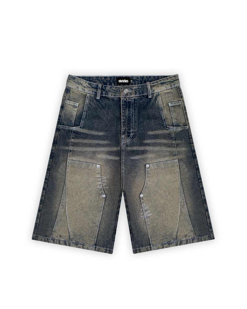 A pair of carpenter style dark blue and yellow denim jorts with a wide fit and logo patch on the front.