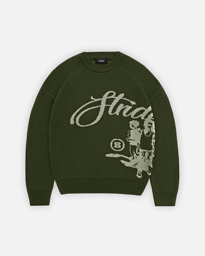 Green sweater with graphic design and text on a white background