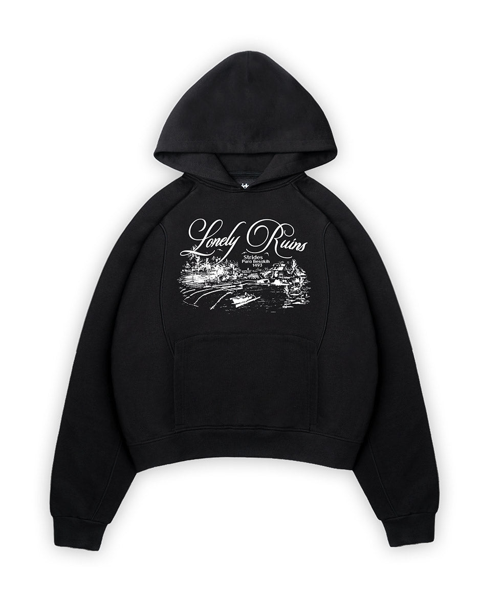 A black hoodie with text and graphic print on the front, featuring line details and a cropped boxy fit.