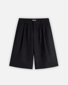 Black shorts with a brand logo on a white background