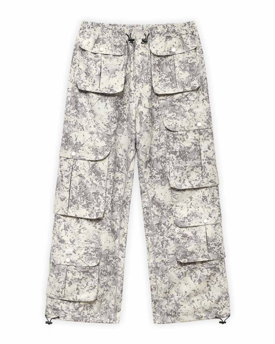 A pair of beige camouflage cargo pants with multiple pockets.