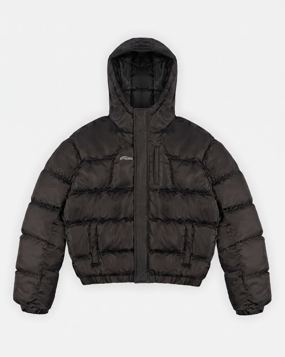 Apex Puffer Black hooded puffer jacket flat lay with storm flap closure and hidden pockets