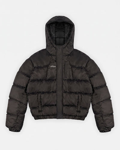Apex Puffer Black hooded puffer jacket flat lay with storm flap closure and hidden pockets