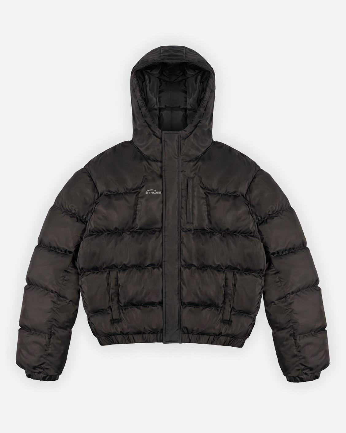 Apex Puffer Black hooded puffer jacket flat lay with storm flap closure and hidden pockets